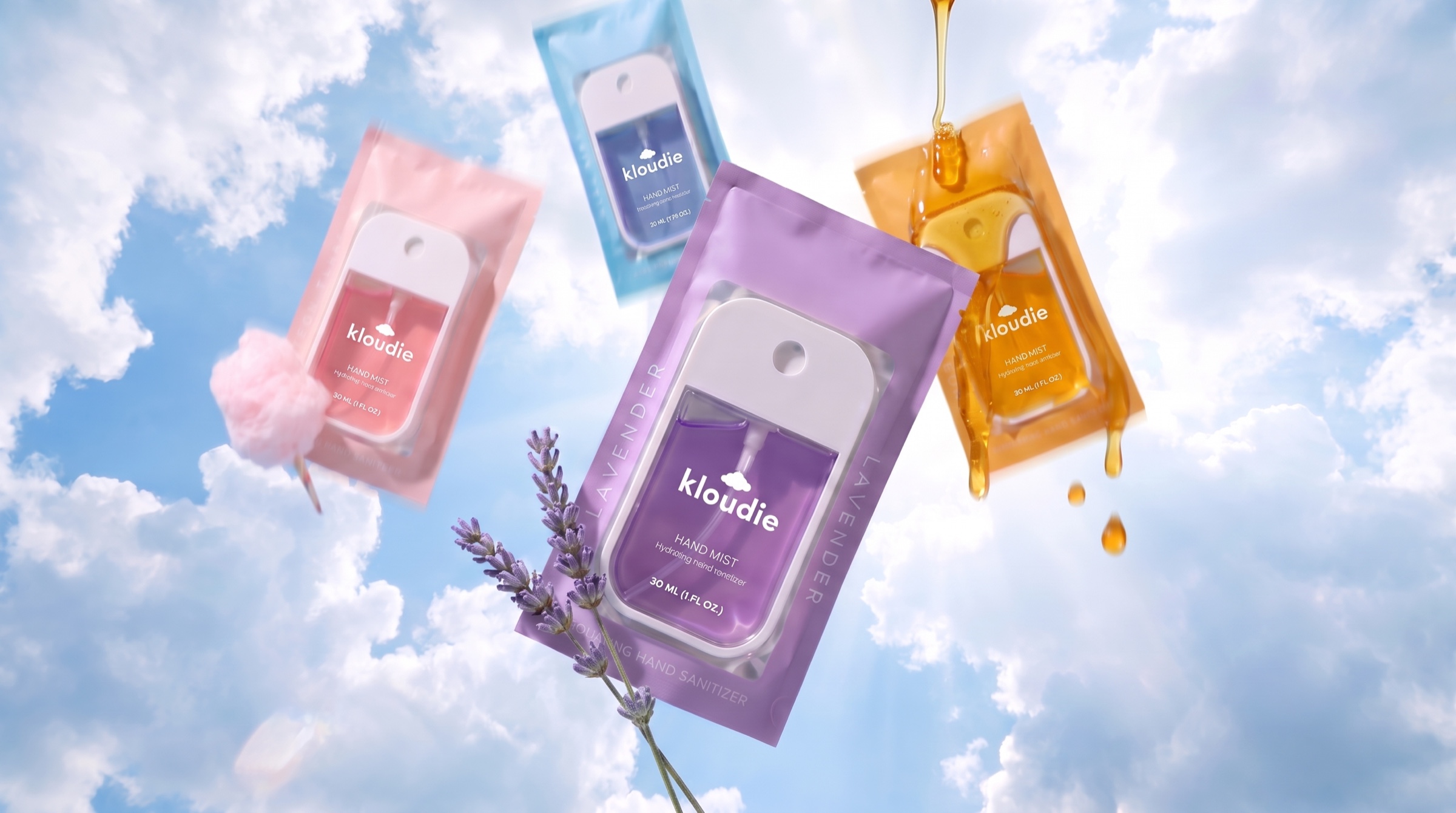Kloudie hand mist pouches floating in a blue cloudy sky with honey drops and lavender